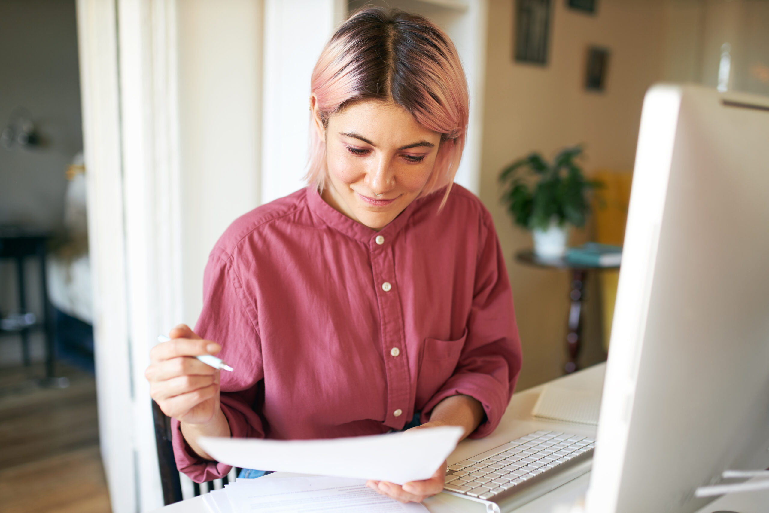 woman looking at checking account statement