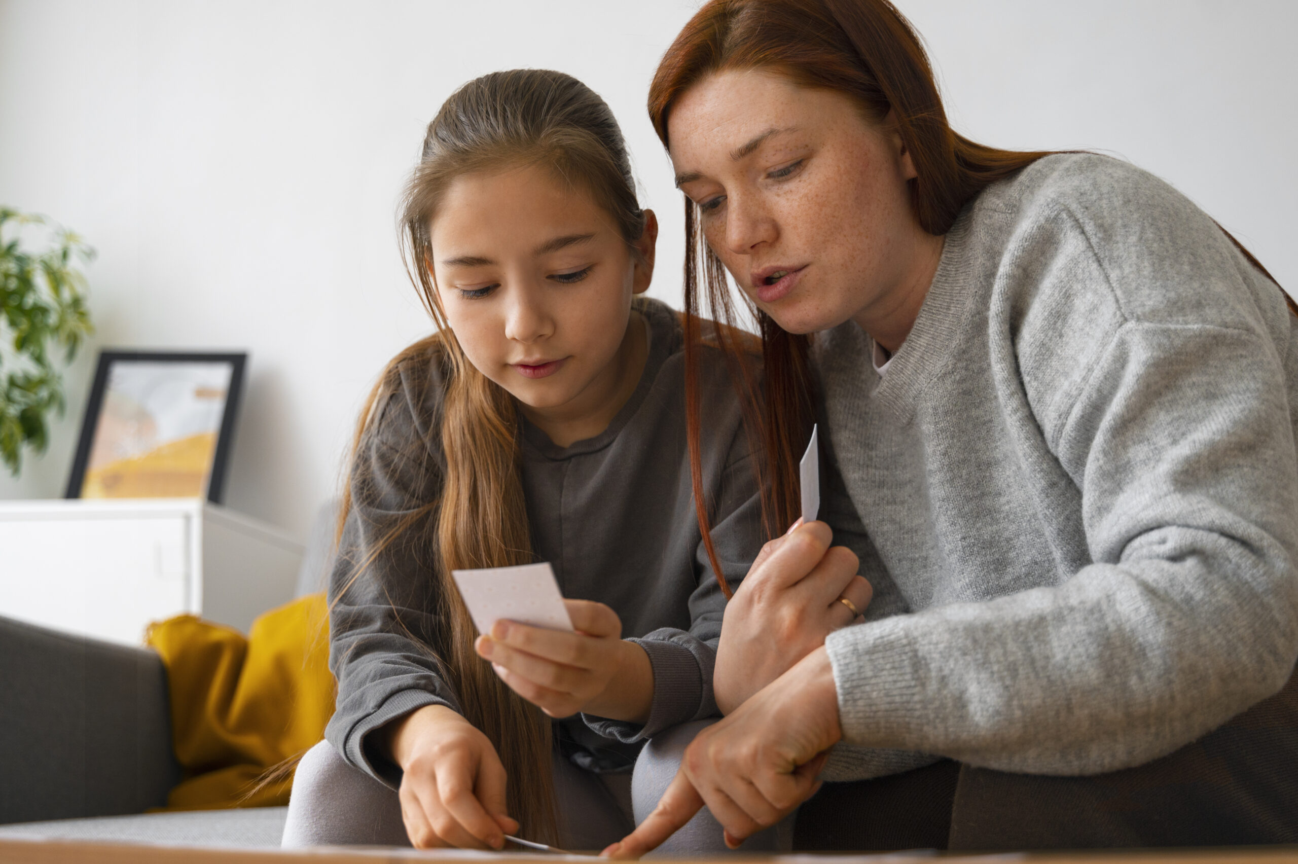 teen with mom leaning about financial education